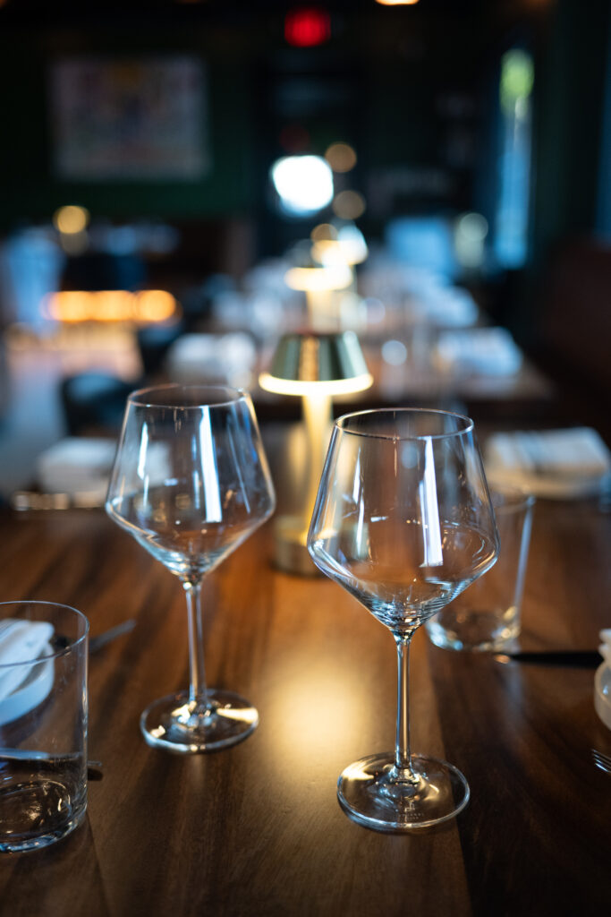 Wine glasses at the bar at Prose