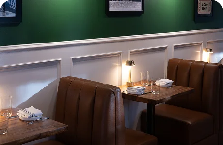 Candlelit booth in the dining room at Prose Kitchen & Bar, home of the summer seasonal menu