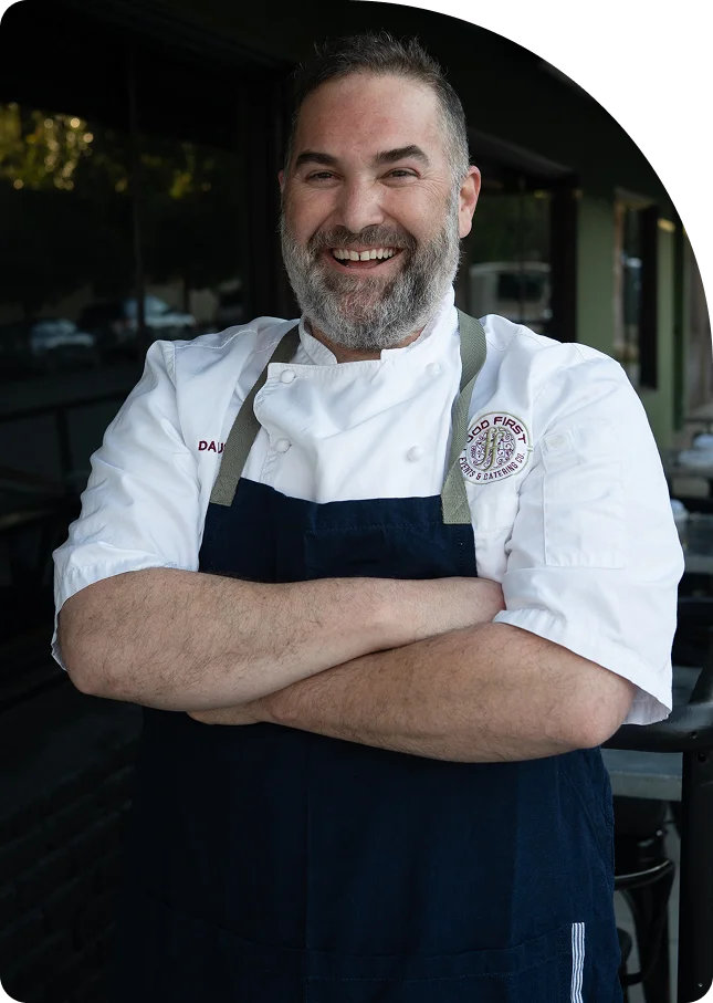 Chef in chef's whites and a navy apron at Prose Kitchen & Bar