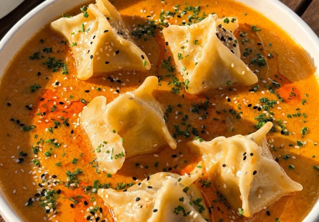 Crab rangoon tortelli in chile-crab butter