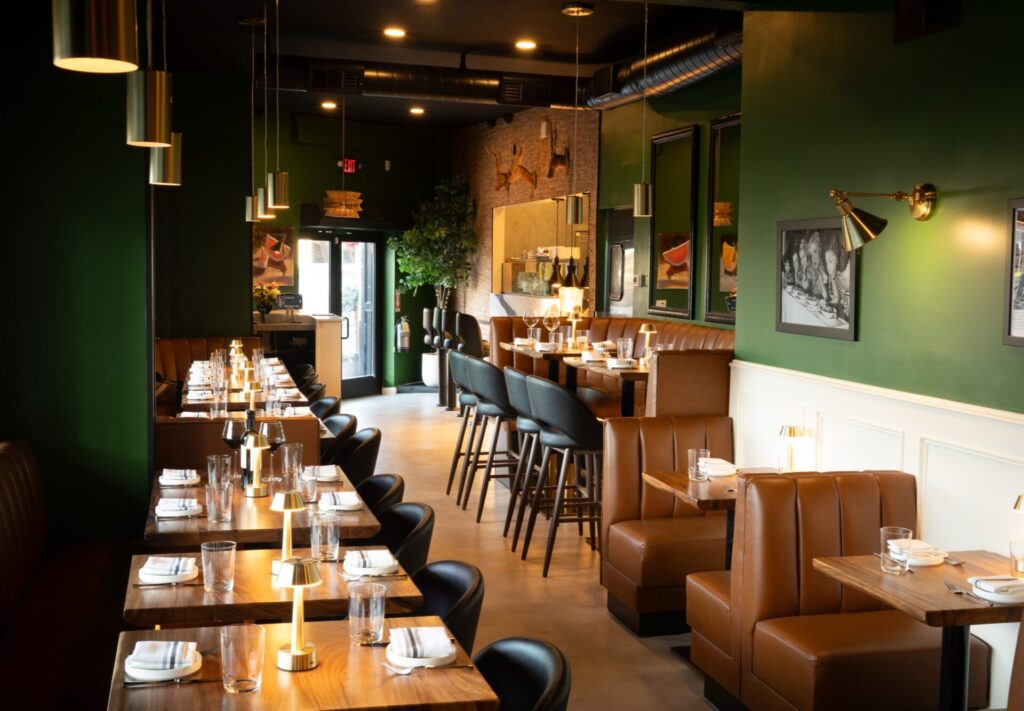 Prose Kitchen & Bar dining room with leather banquettes and brass lamps