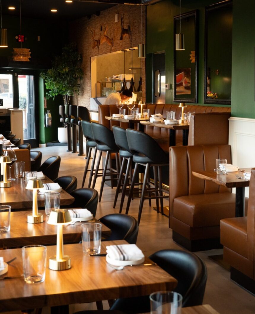 Dining room at Prose Kitchen & Bar with the open kitchen in back