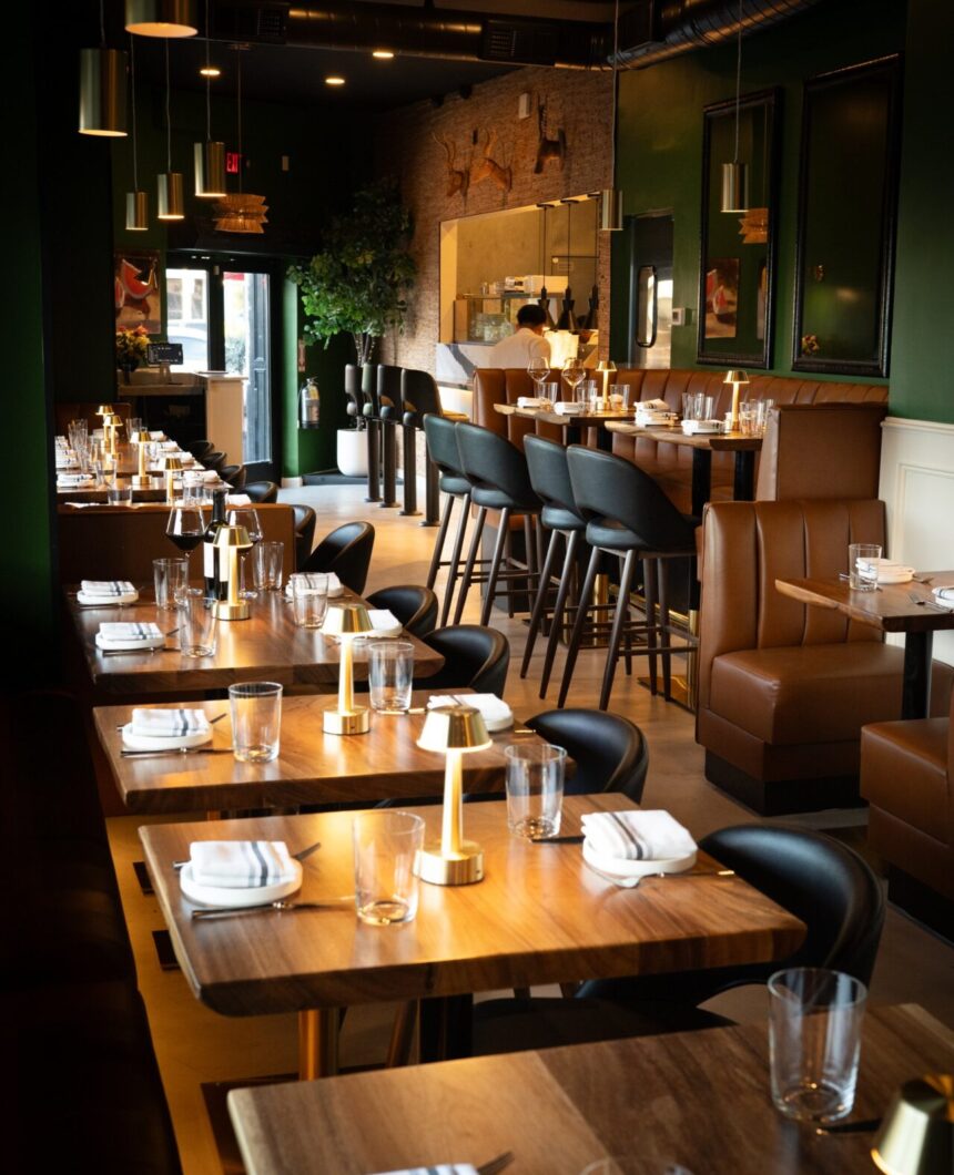 Set tables leading to the open kitchen at Prose Kitchen & Bar
